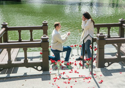 man proposing to girlfriend on dock