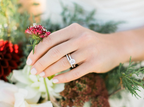 woman wearing a solitaire engagement ring