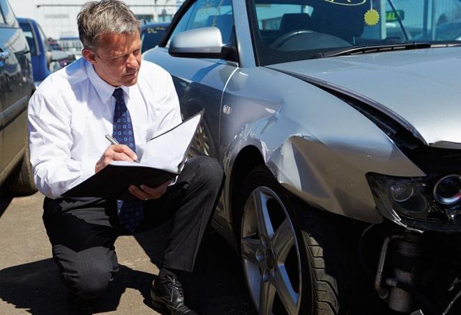 a family reviewing auto insurance options with an agent